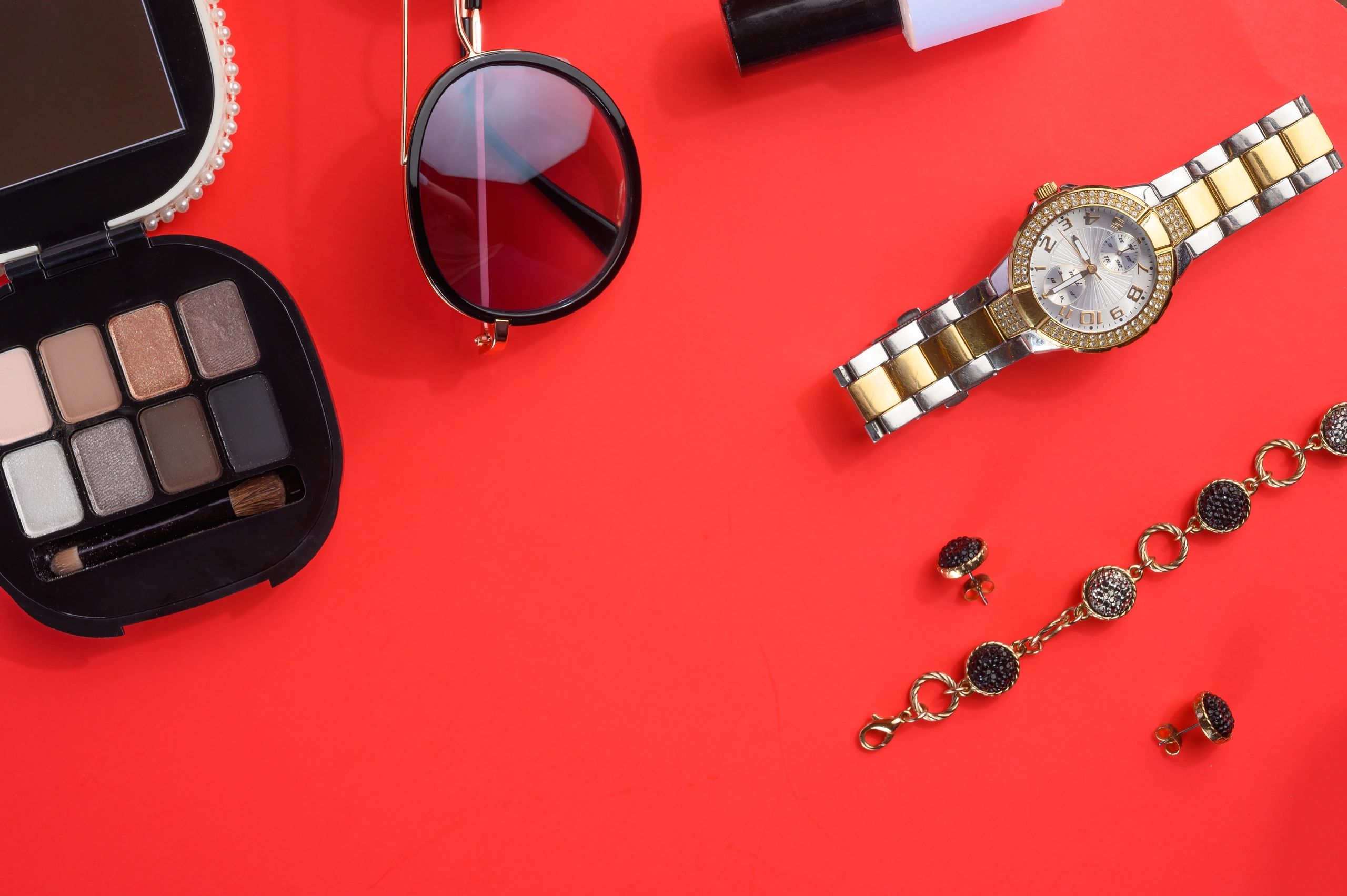 Luxury women's accessories styled for an editorial flat lay